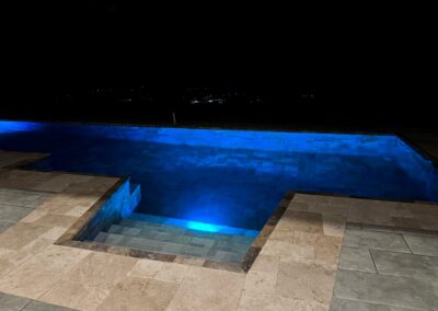 The pool illuminated at night.