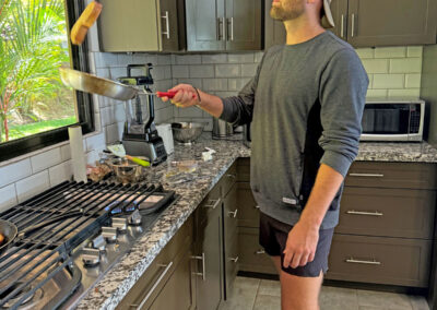 Nelson making breakfast in the kitchen.
