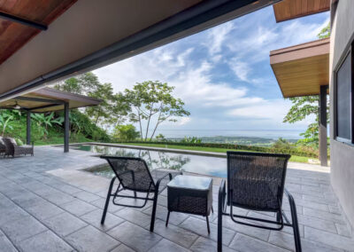 Sitting area under the covered breezeway overlooking the pool and the ocean, including the famous Whale's Tail.