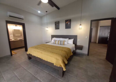 The Selva (Jungle) Suite, located adjacent to the kitchen and living area, includes a king bed and en-suite bathroom.