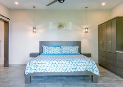 The lower level suite, Oceano (Ocean) Suite features a king size bed, clothing storage and an en-suite bath.