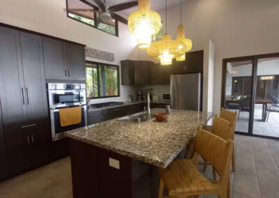 The kitchen in Villa Ballena is equipped with state-of-the-art appliances and a large island perfect for entertaining.