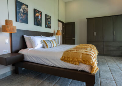 Clothing storage in the Selva Suite of Villa Ballena beside the king bed.