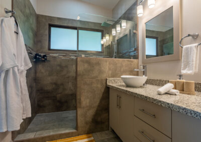 Villa Ballena's Selva ensuite bathroom features a spacious, luxury walk-in shower and two robes.